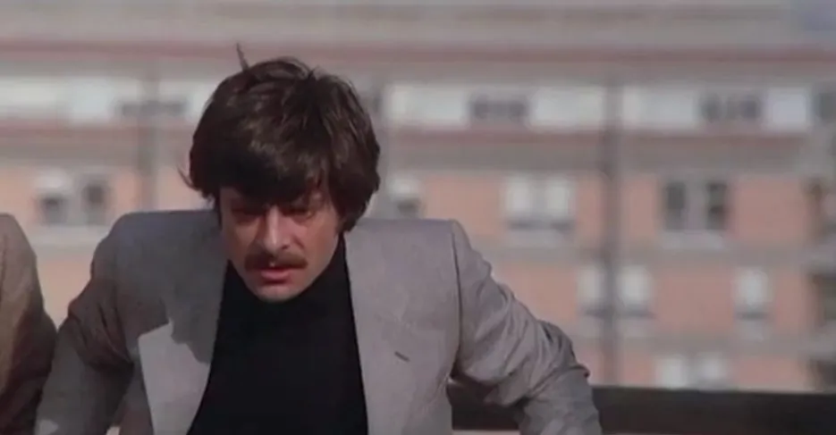 A screenshot taken from The Black Belly of the Tarantula. It shows a man, inspector Tellini, who looks deeply shocked.